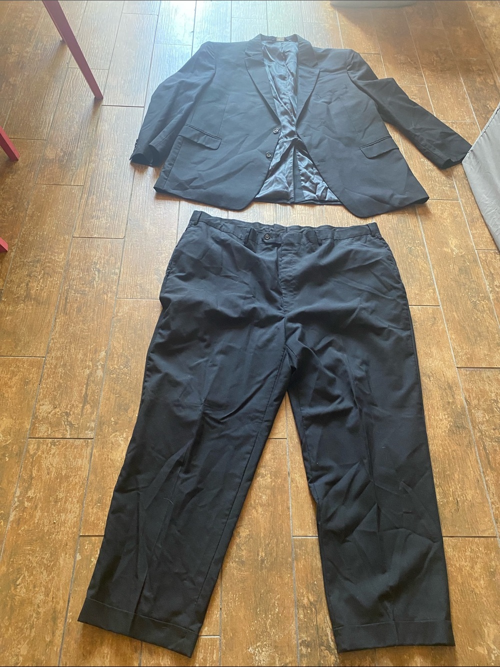 Jos. A. Bank Black Suit. Jacket is 52L, pants are 48L. Great condition.